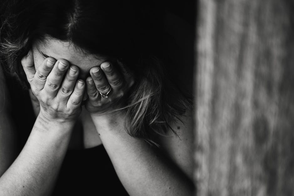 Distressed woman facing addiction and domestic violence