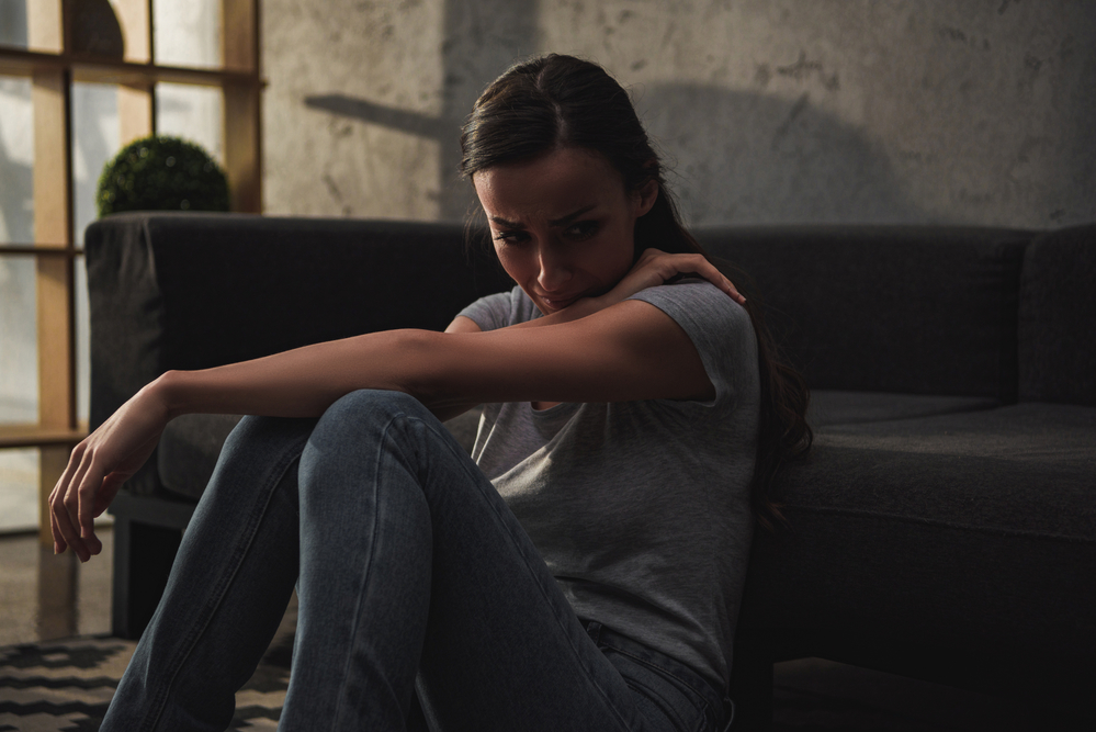 A woman experiencing emotional distress related to PTSD