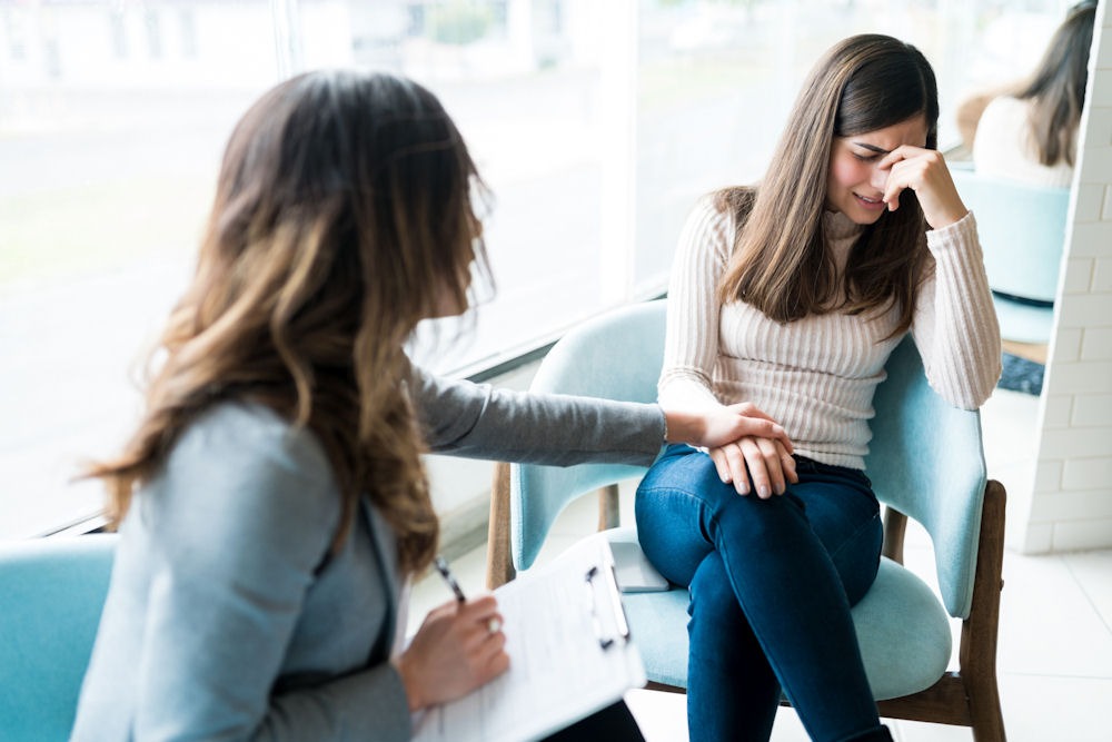 a woman suffering from schizophrenia and addiction attending therapy