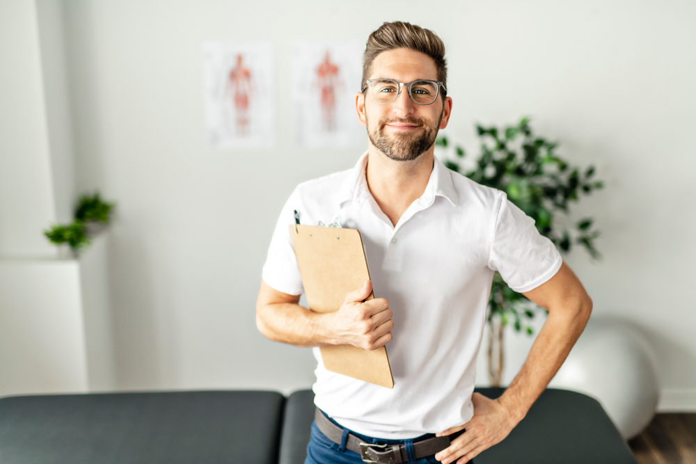 A Modern rehabilitation physiotherapy man at work male therapist who works with dual diagnosis